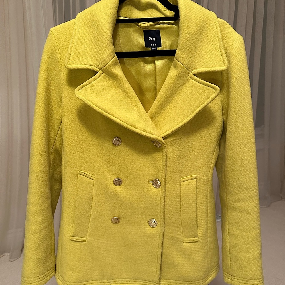 Yellow GAP jacket with golden buttons.